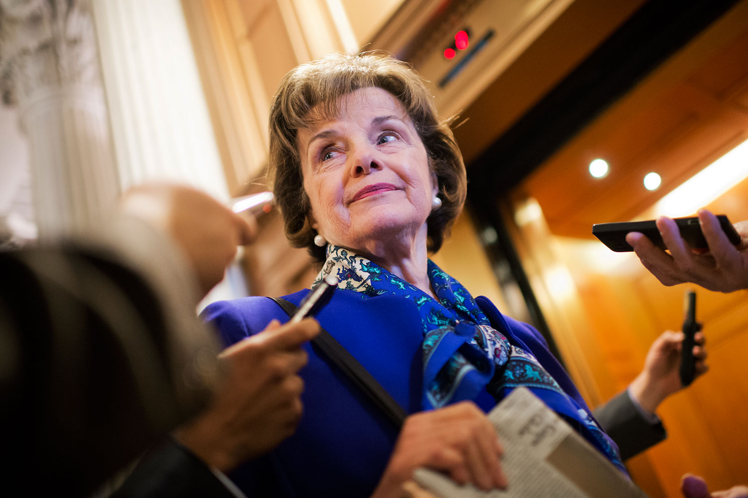 Sen. Dianne Feinstein, chairman of the Senate Intelligence Committee, speaks with reporters in the Capitol after a speech on the Senate floor that accused the CIA of searching computers set up for Congressional staff for their research of interrogation programs, March 11, 2014. (Tom Williams—CQ-Roll Call/Getty Images)