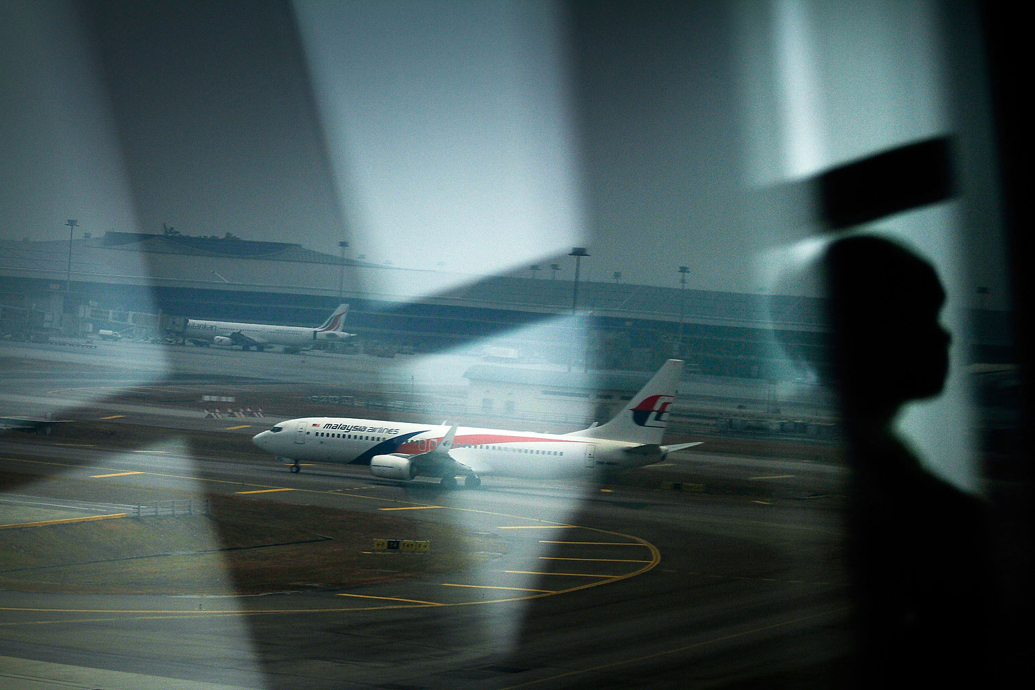 A Malaysian Airlines plane is seen on the tarmac at Kuala Lumpur International Airport on March 12, 2014 in Kuala Lumpur.
