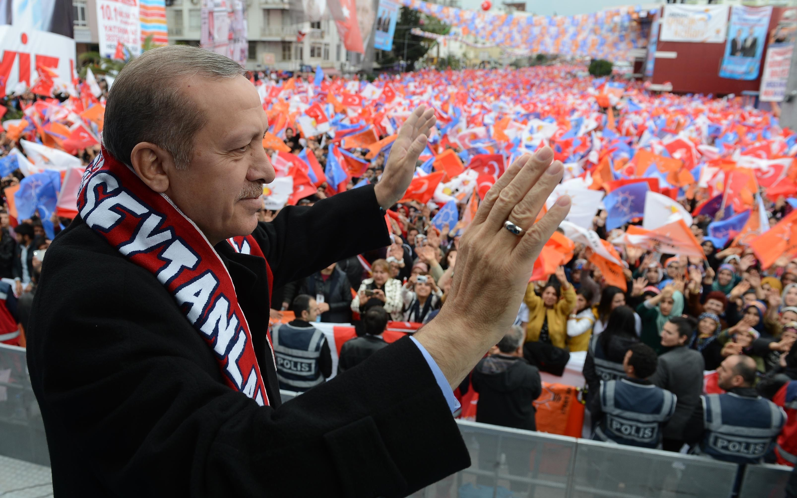 Turkish Prime Minister Recep Tayyip Erdogan greets the crowd during a local election rally organized by the ruling Justice and Development Party (AKP) in Mersin, Turkey on March 13, 2014 (Kayhan Ozer—Anadolu Agency/Getty Images)