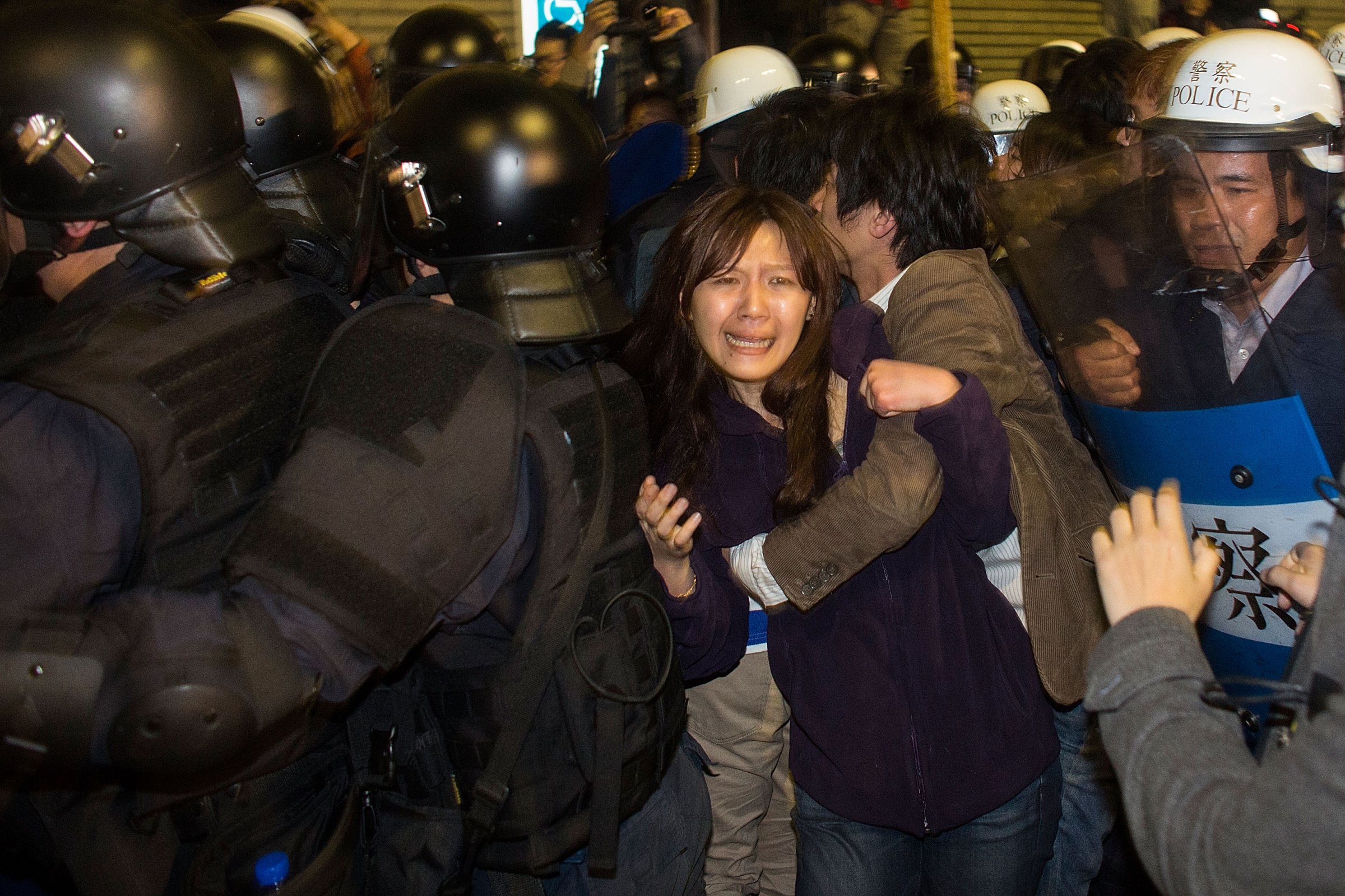 Riot police clash with student protesters outside Taiwan's cabinet offices in Taipei on March 24, 2014. Clashes erupted after Taiwan's President refused to scrap a contentious trade agreement with China and denounced the "illegal" occupation of government buildings by students opposed to its ratification