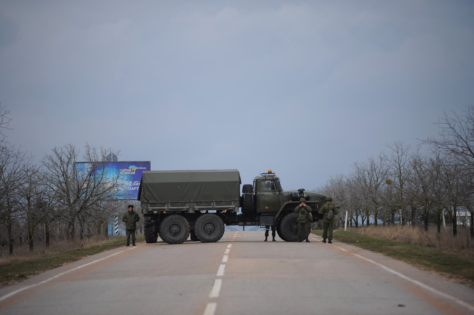 Russian troops block the road way towards the military airport at the Black Sea port of Sevastopol in Crimea, Feb. 28, 2014.