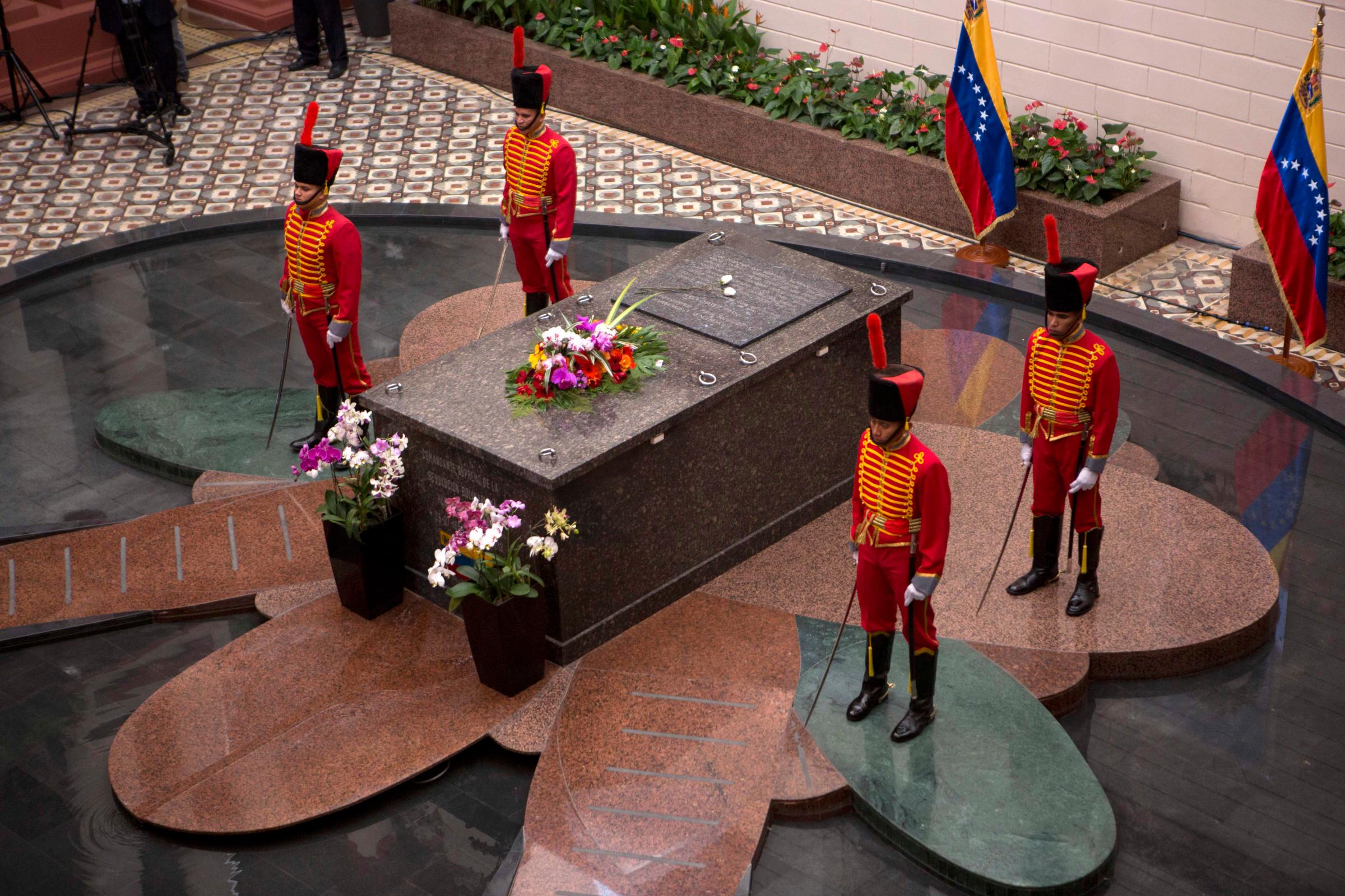 Presidential guards stand next to the tomb of Venezuela's late President Hugo Chavez at the former military barracks that was turned into Chavez's mausoleum in Caracas, March 5, 2014.