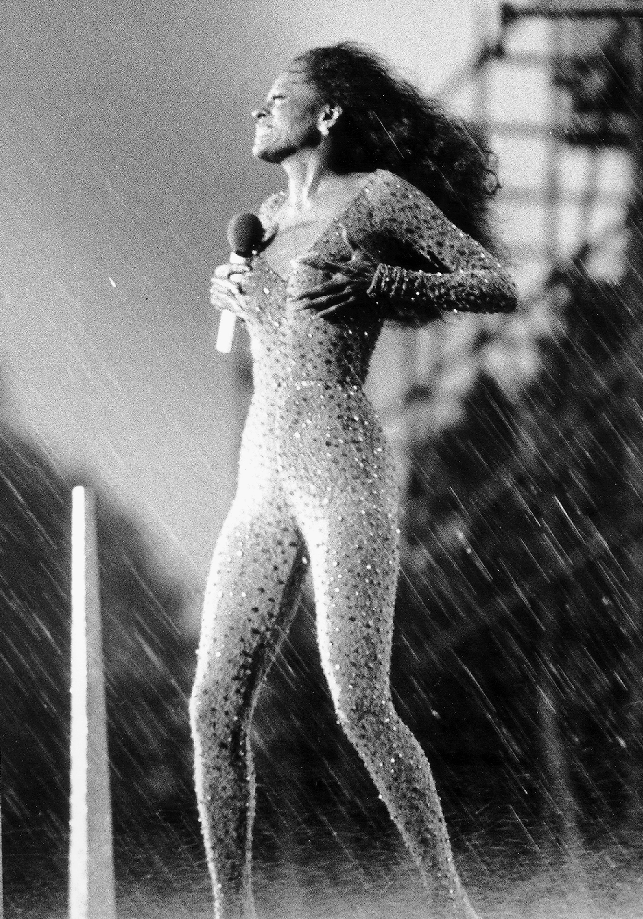 A torrential downpour, with winds gusting up to 55 miles per hour, pelt pop singer Diana Ross during a free outdoor concert in Central Park, her  gift to New York.  on July 21, 1983.