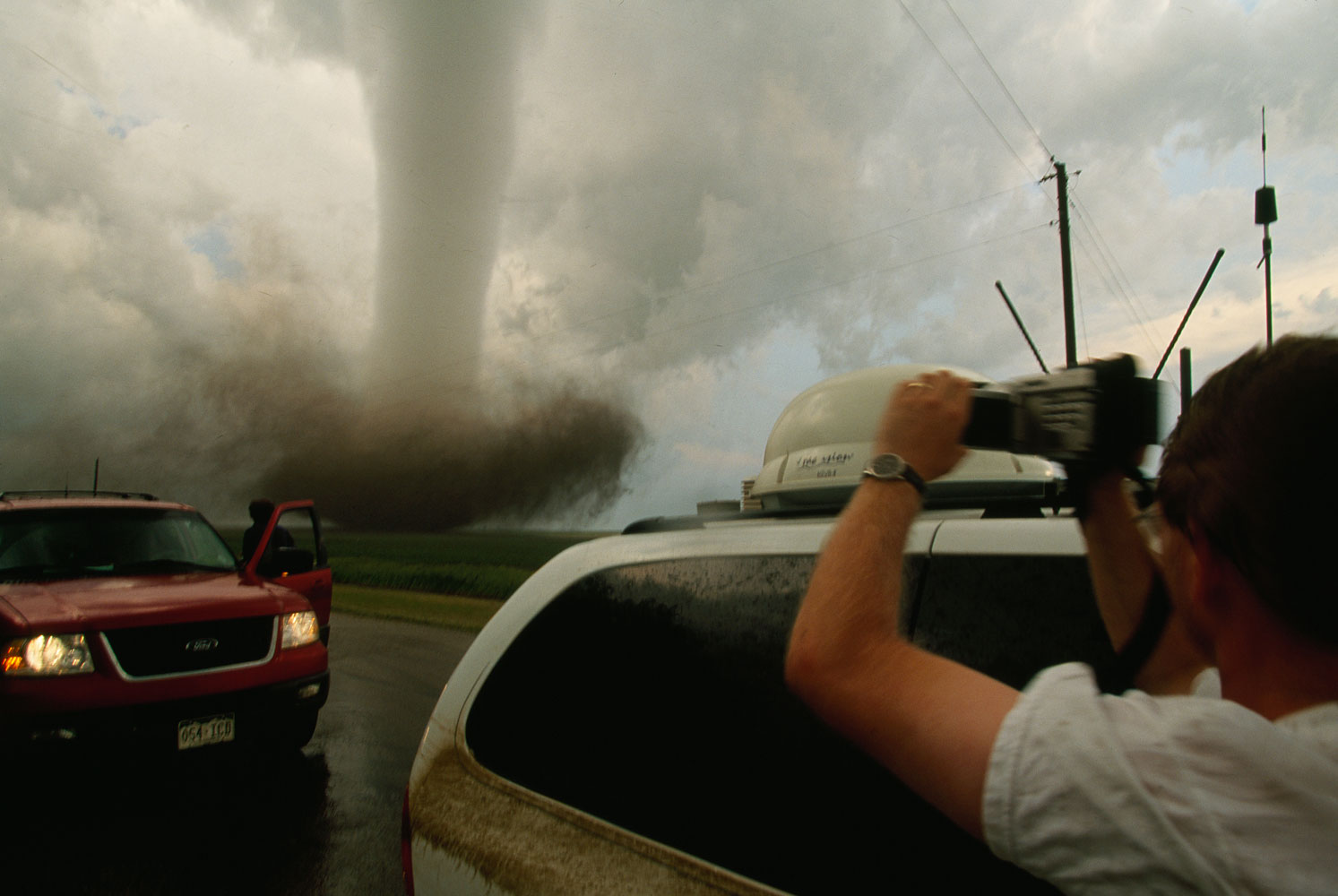 A storm chaser video taping a very close tornado