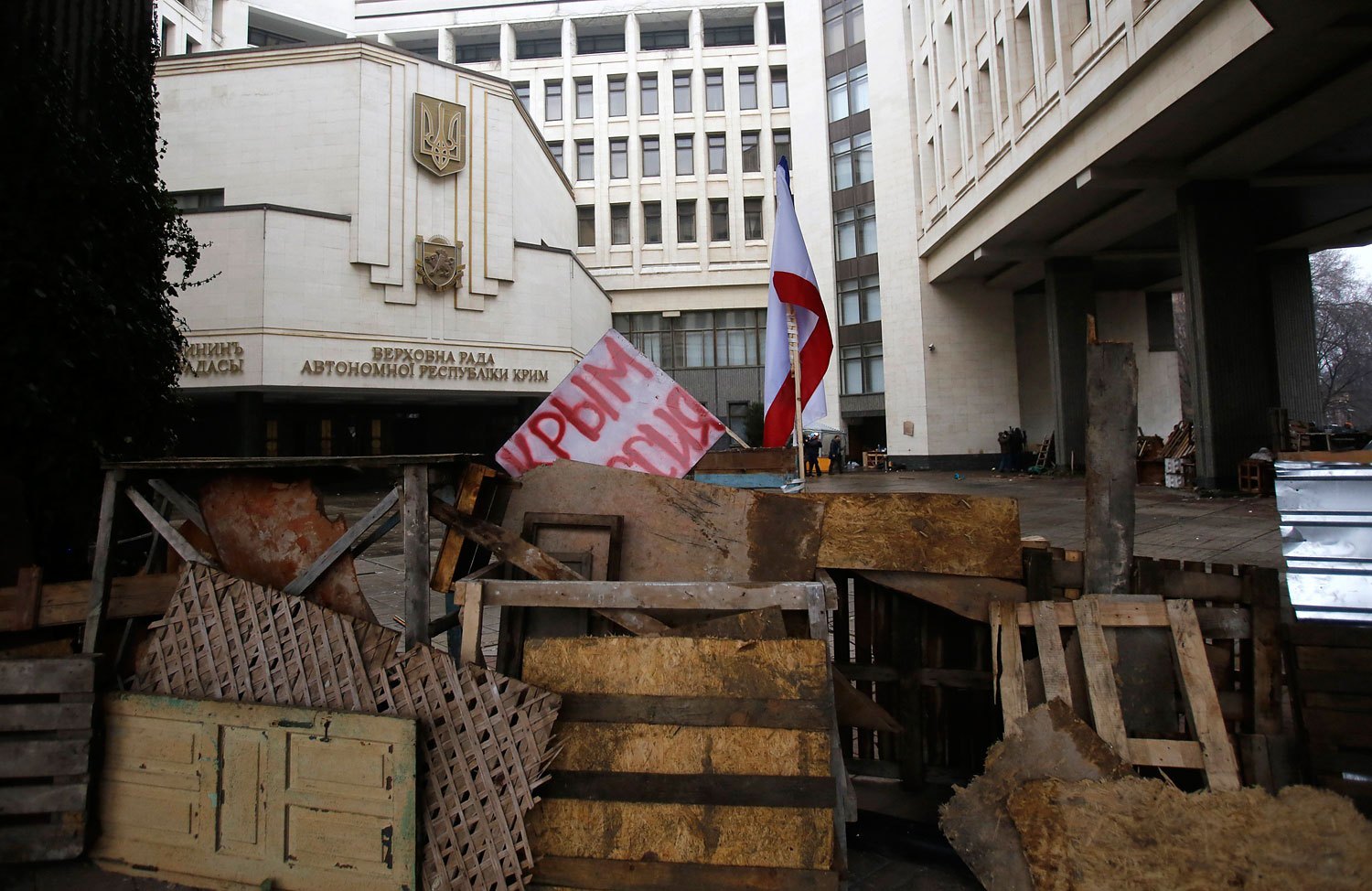 Barricades block the entrance to government buildings in Simferopol, Crimea, with a banner that reads "Crimea Russia," Feb. 27, 2014.