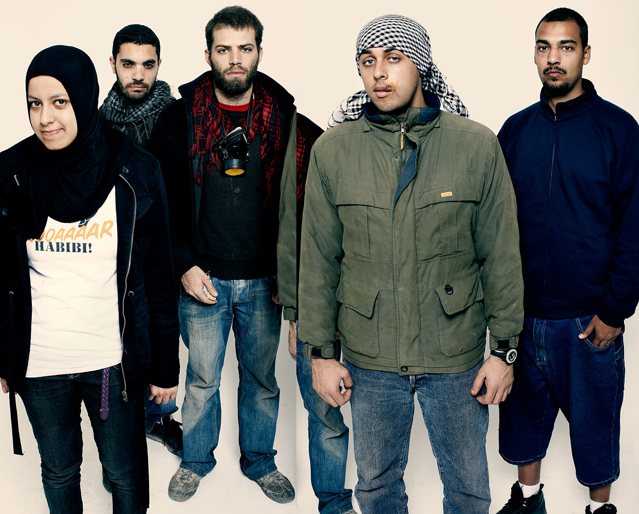Ali Mustafa, far right, stands for a portrait in Cairo in November 2011 as TIME photographed protesters, who it named Person of the Year (Peter Hapak for TIME)