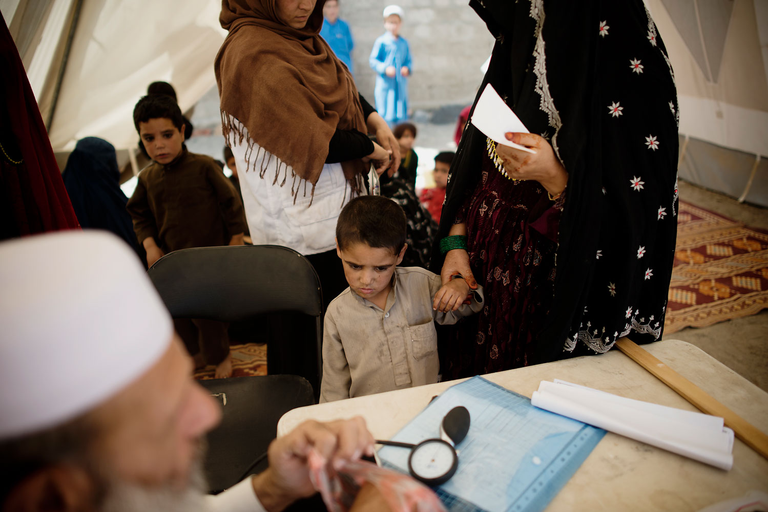 Children come for vaccinations and other care at the MSF mobile clinic in the village of Spina Poza just east of Kabul.