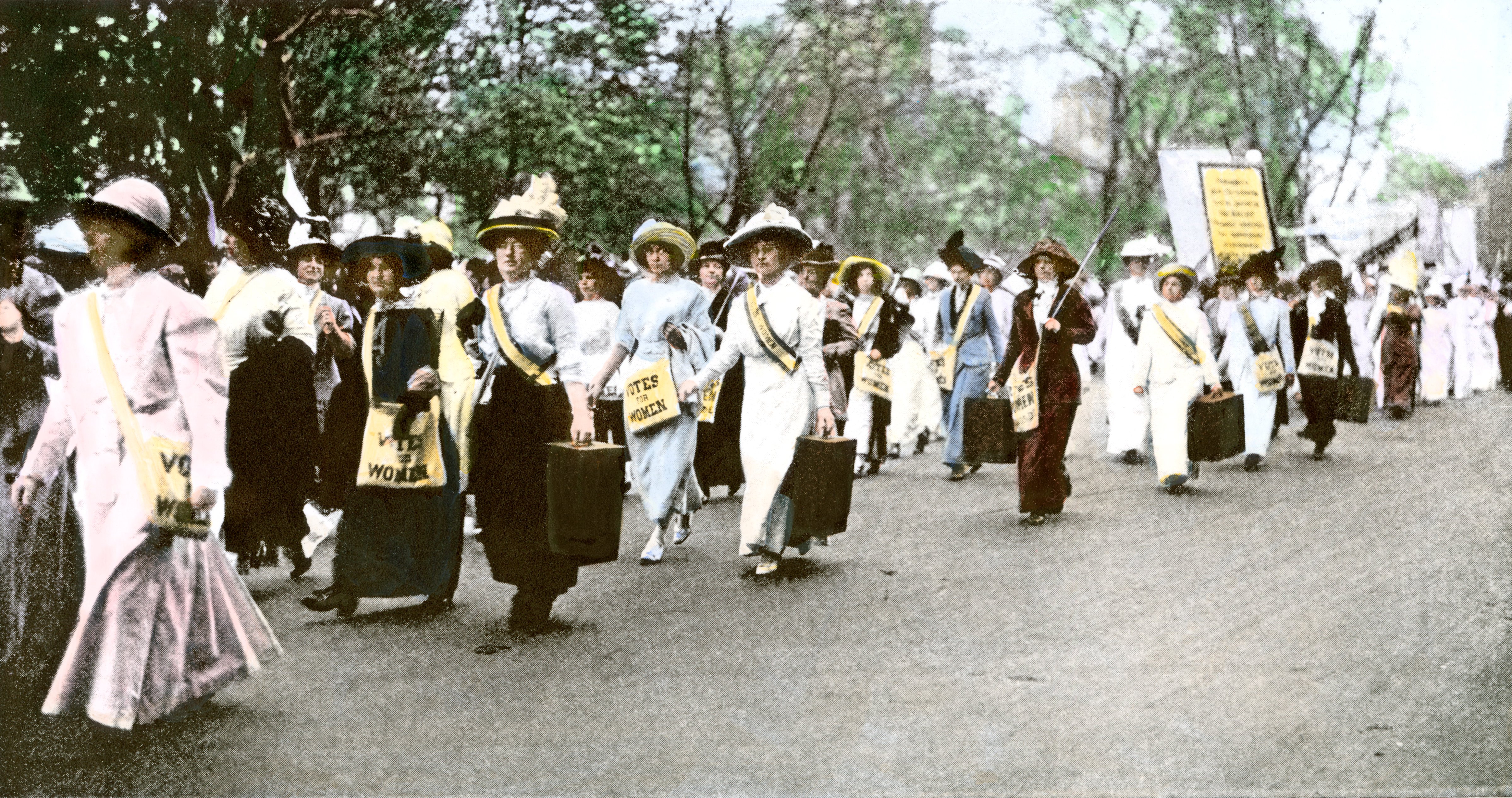 Suffragette marchers carrying portable speaker rostrums, New York City, 1912.
                      Hand-colored halftone reproduction of a photograph (North Wind Picture Archives via AP Images)
