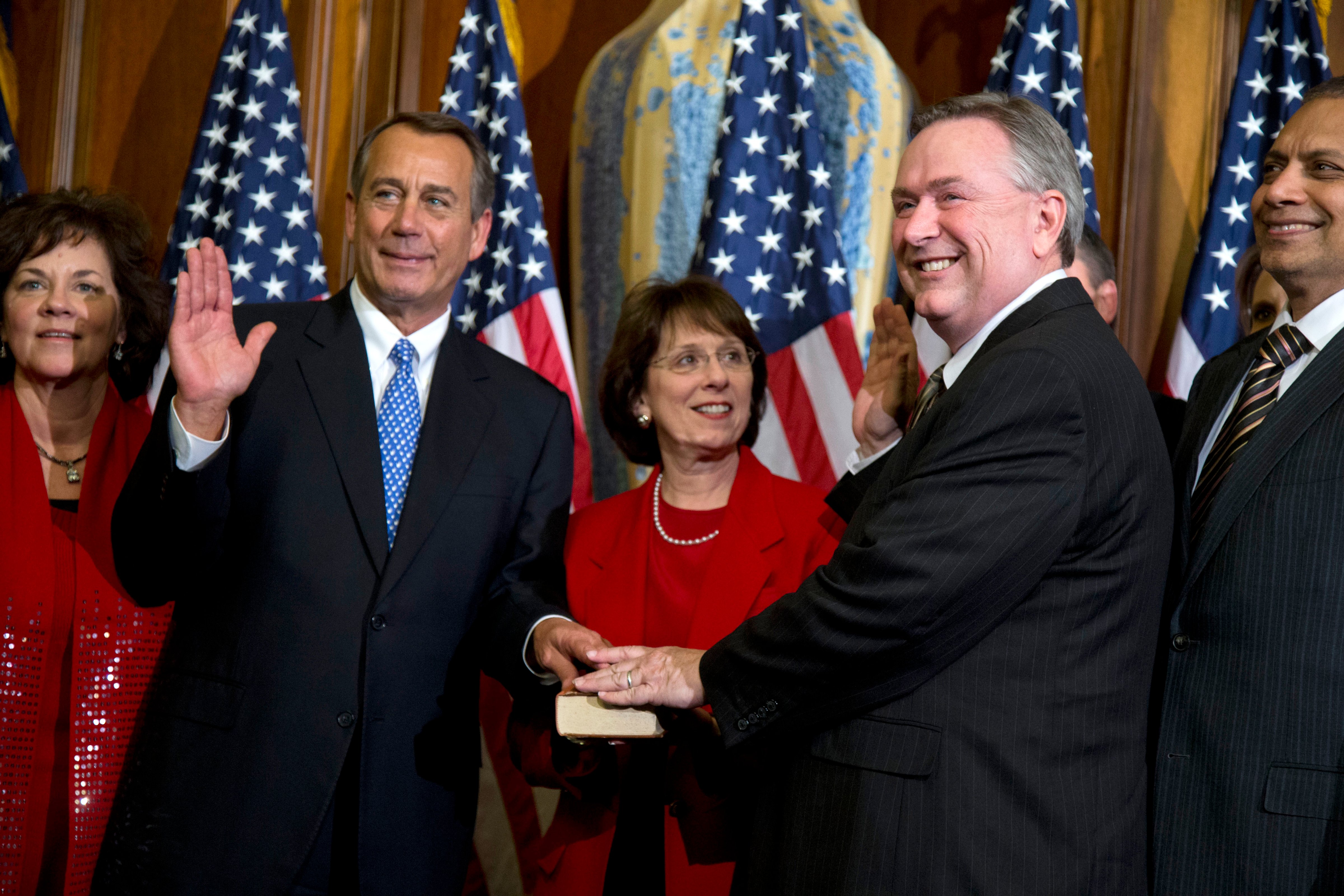 Rep. Steve Stockman, R-Texas, second from right, participates in a mock swearing-in ceremony with Speaker of the House Rep. John Boehner, R-Ohio, for the 113th Congress in Washington, Jan. 3, 2013. (Evan Vucc—AP)