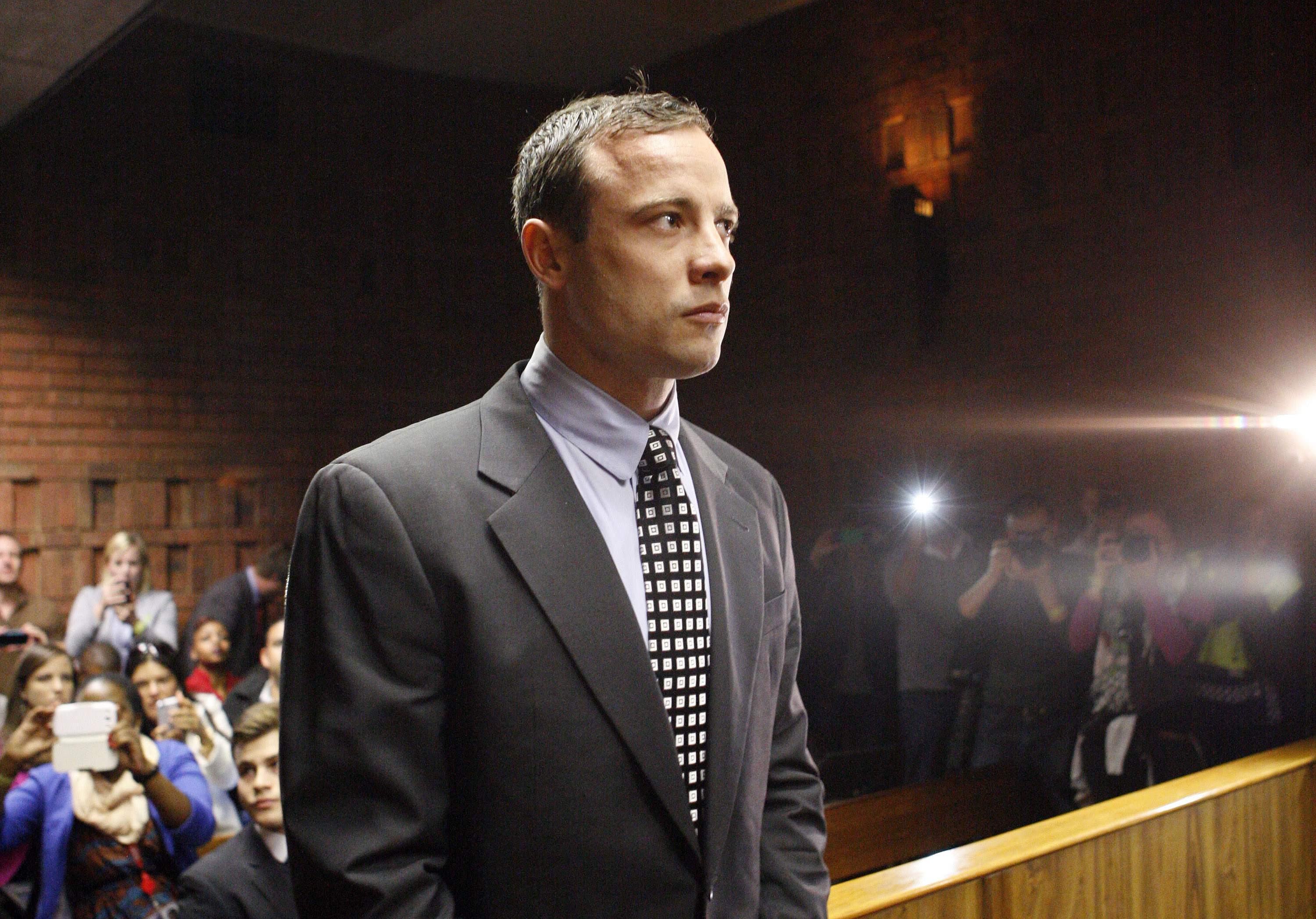 Double-amputee Olympian, Oscar Pistorius, looks on as he appears in the magistrates court in Pretoria, South Africa, Tuesday, June 4, 2013. (Themba Hadebe—AP)