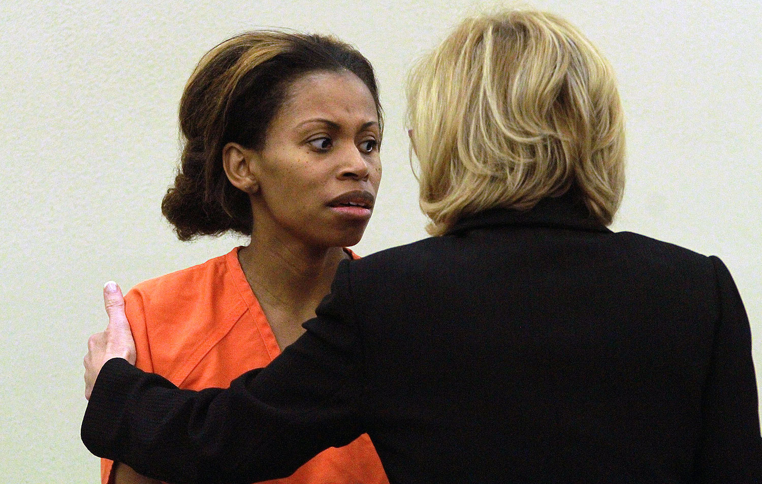 Ebony Wilkerson, left, talks to her assistant public defender Nora Hall during her first appearance before a Volusia County Court Judge, Saturday, March 8, 2014, in Daytona Beach, Fla. (Jim Tiller—AP)