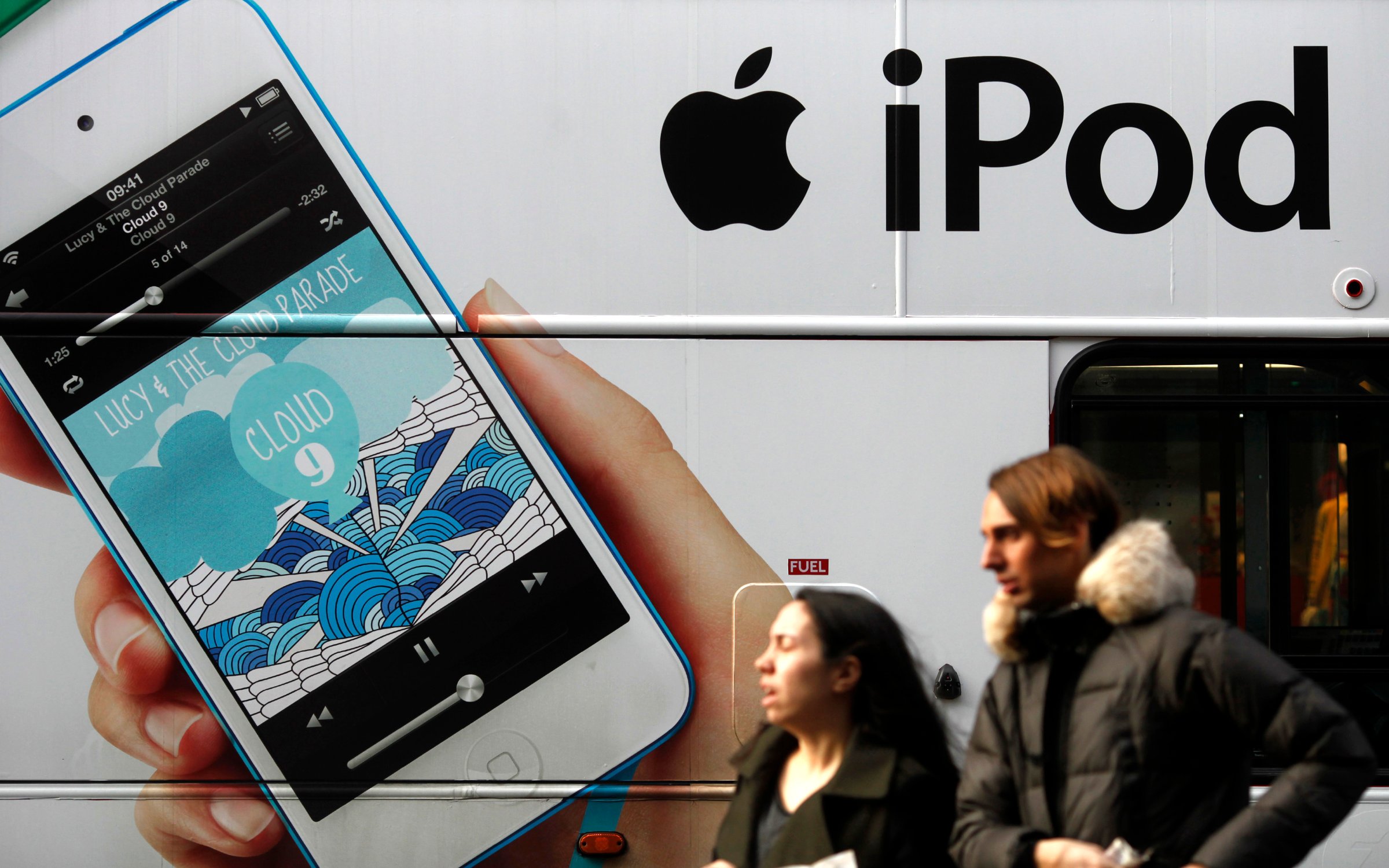 An advertisement for Apple's iPod is displayed on the side of a London bus, Dec. 21, 2012.