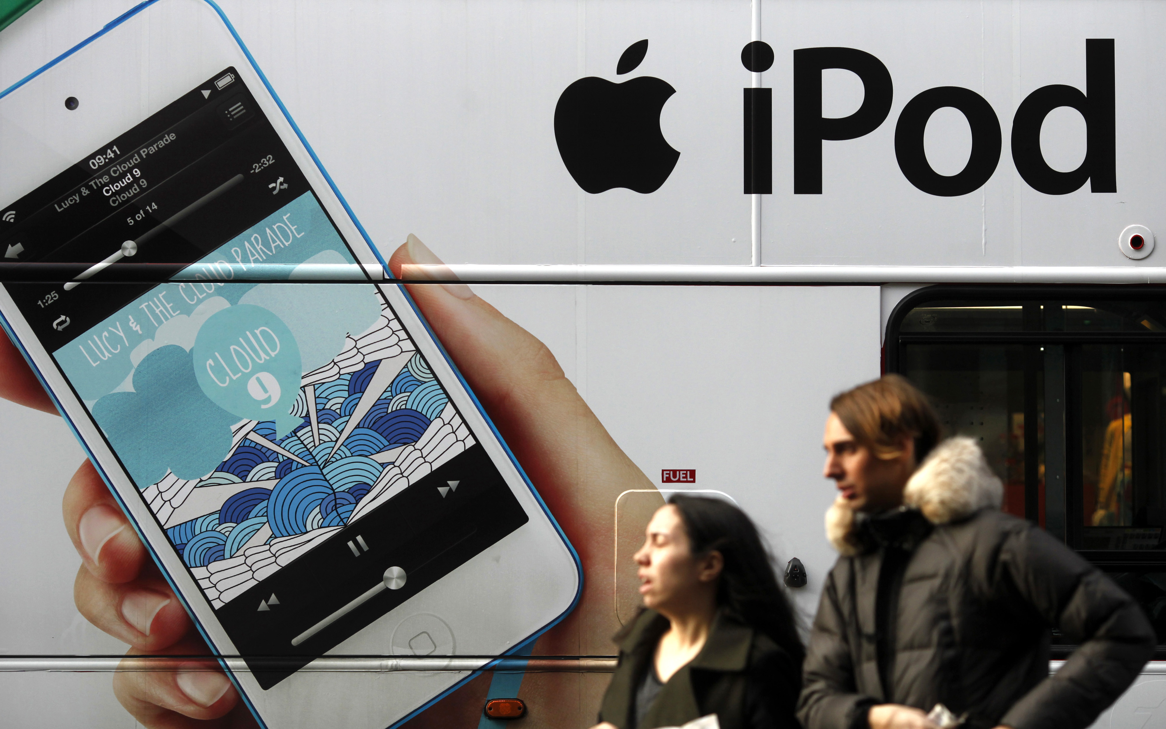 An advertisement for Apple's iPod is displayed on the side of a London bus, Dec. 21, 2012. 