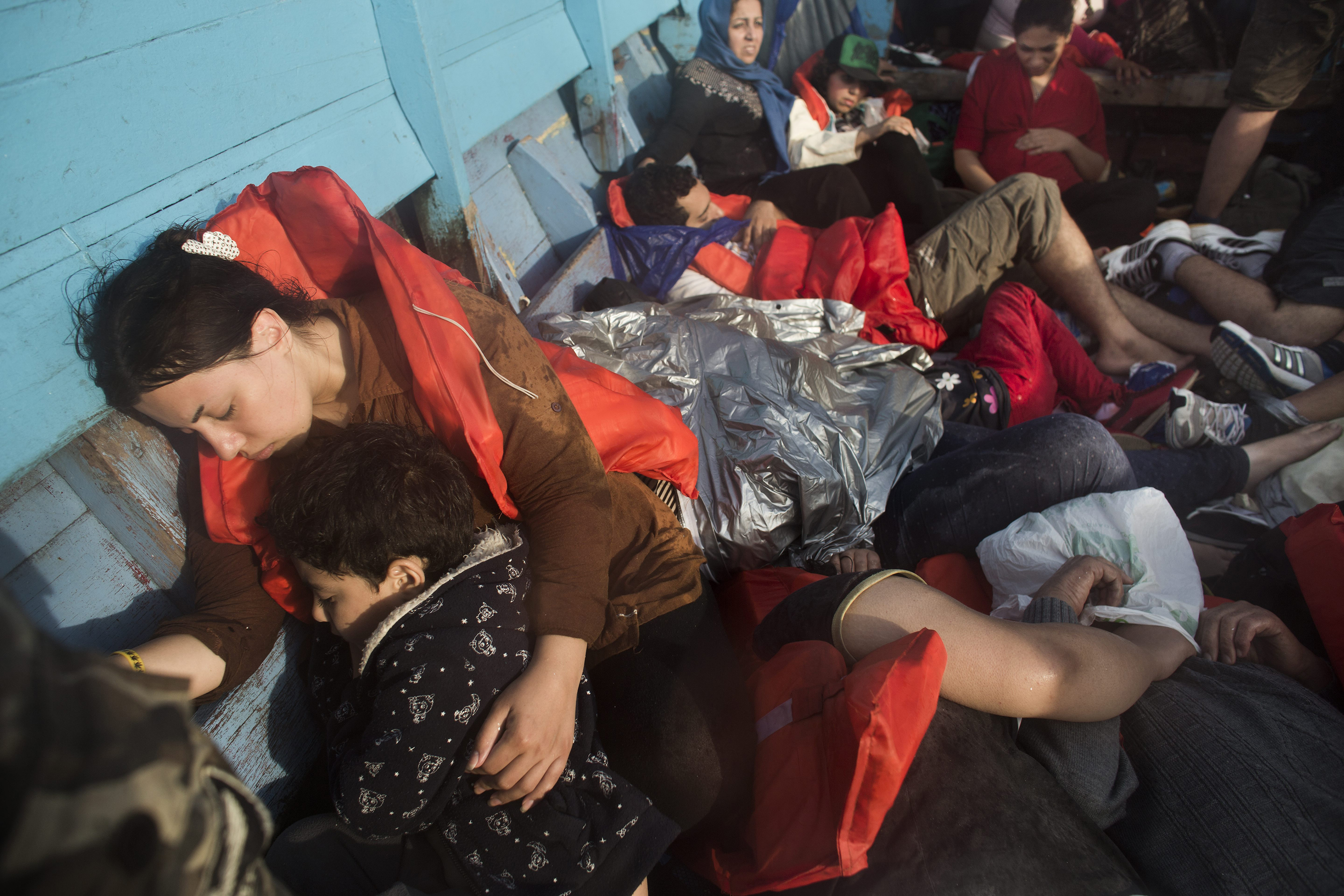 A group of asylum seekers—all Iranian except for one Afghan—en route by boat from Indonesia to Australia on Sept. 7, 2013. (Joël van Houdt—Hollandse Hoogte/REDUX)
