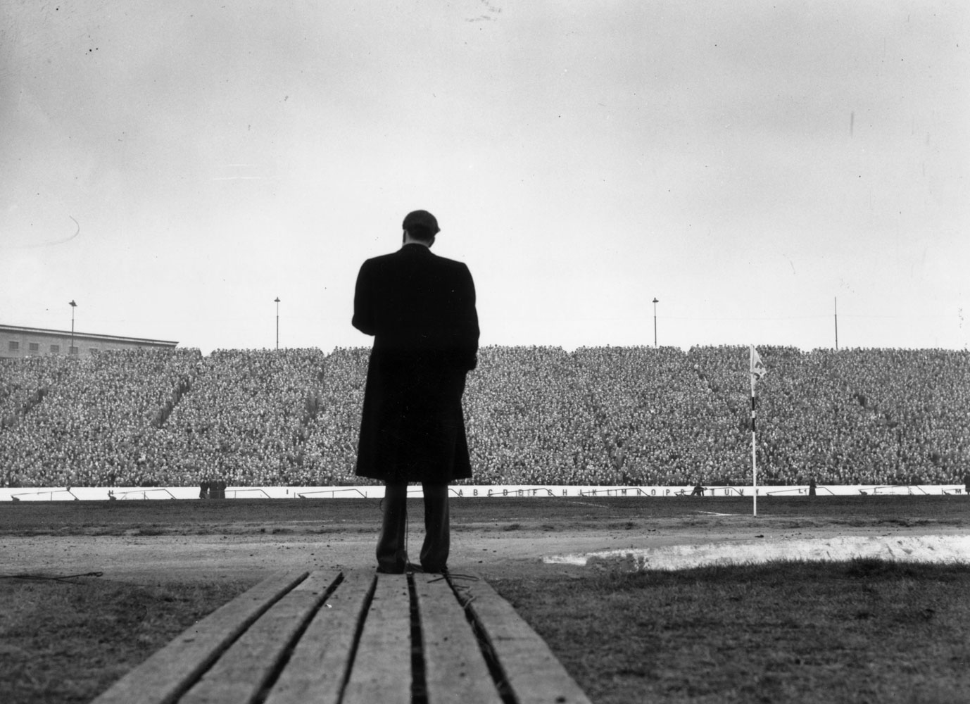 On a trip to the United Kingdom, Graham addresses a crowd of football supporters at Stamford Bridge, London, during half-time at a match between Chelsea and Newcastle United.