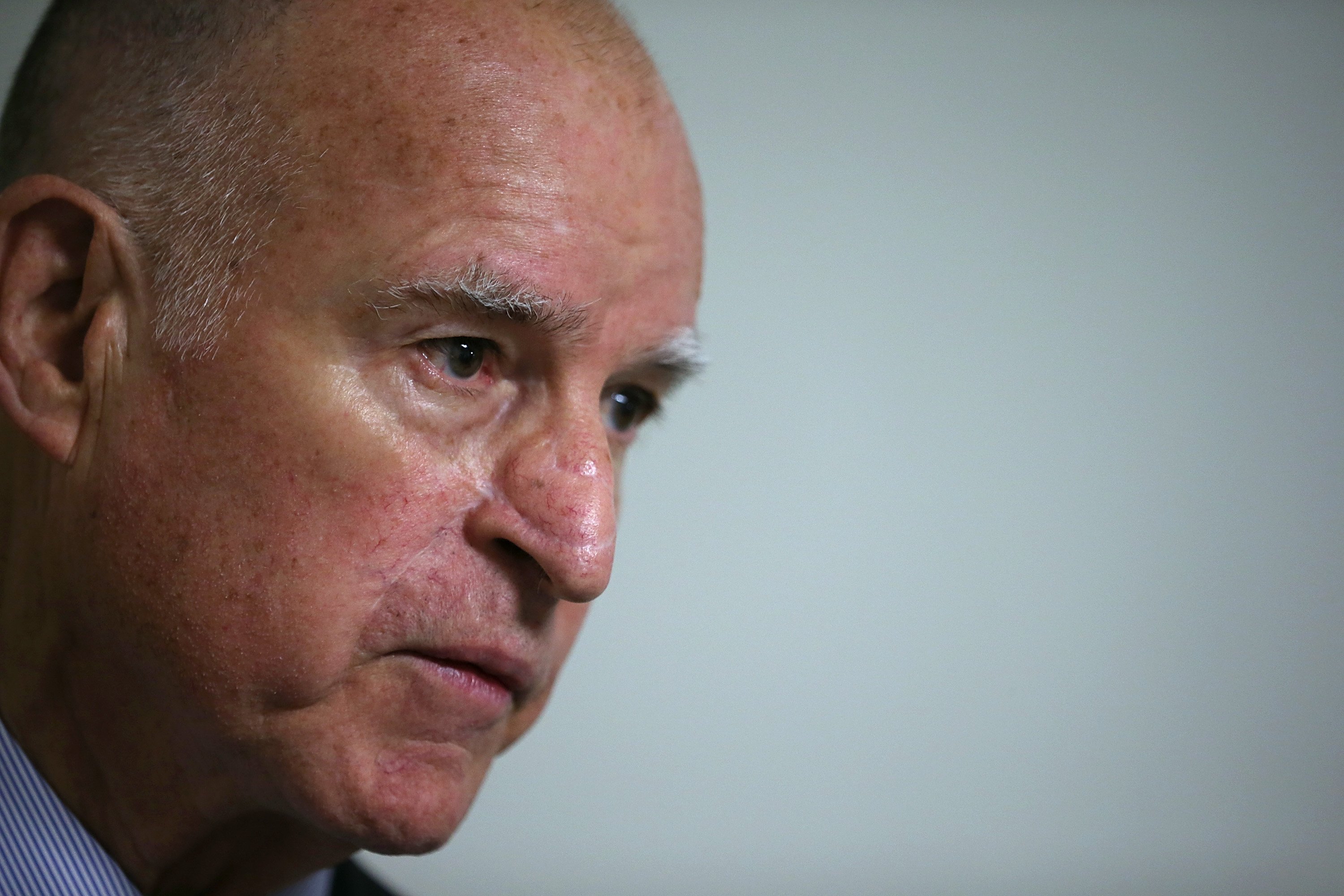 California Gov. Jerry Brown speaks to reporters after filing paperwork for re-election at the Alameda County Registrar of Voters on Feb. 28, 2014 in Oakland, Calif. (Justin Sullivan—Getty Images)