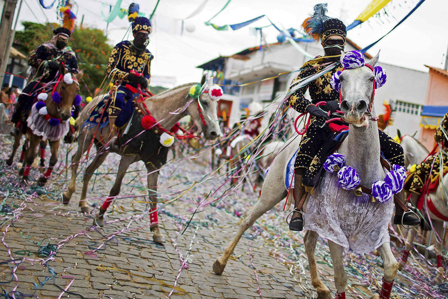 Revellers participate in the traditional Carnival on horseback in Bonfim