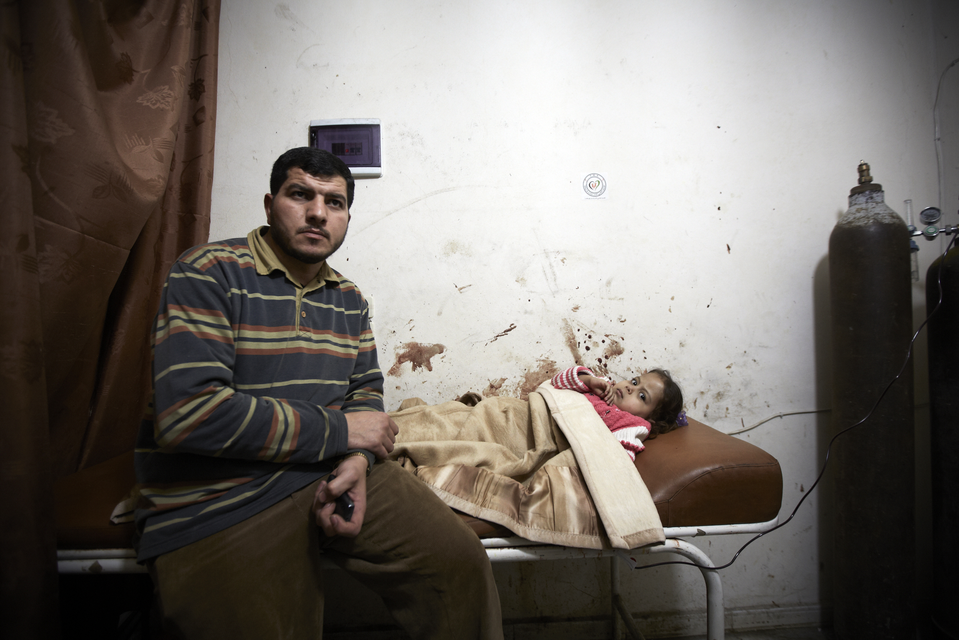 A wounded child is treated in a make shift hospital in Aleppo after her home was randomly targeted by the regime's artillery, on March 15, 2013. (Sebastiano Tomada—SIPA USA/AP)