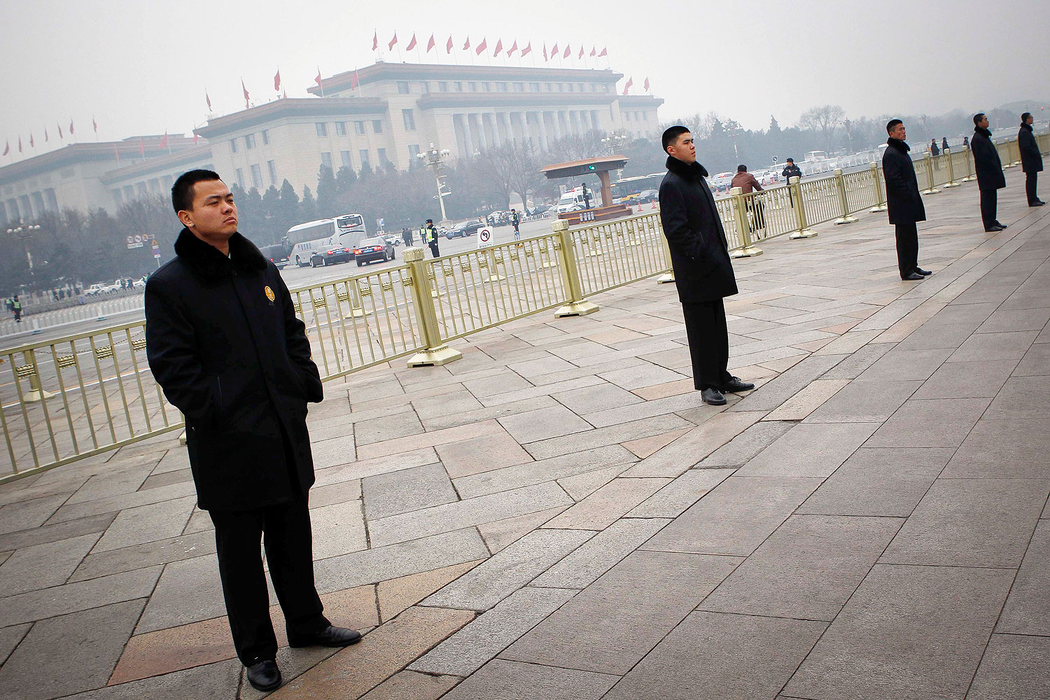 Chinese security guards stand in line in Tiananmen Square in Beijing, on March 3, 2014. Beijing has stepped up security for the NPC and CPPCC sessions this week (Gao zheng / Imaginechina / AP)