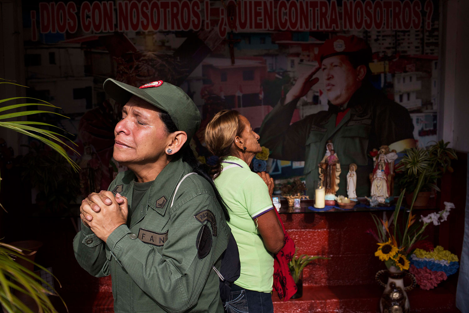Marisol Perez, Venezuelan Army specialist, cries while visiting a chapel near Venezuela's late President Hugo Chavez's mausoleum in Caracas, March 5, 2014.