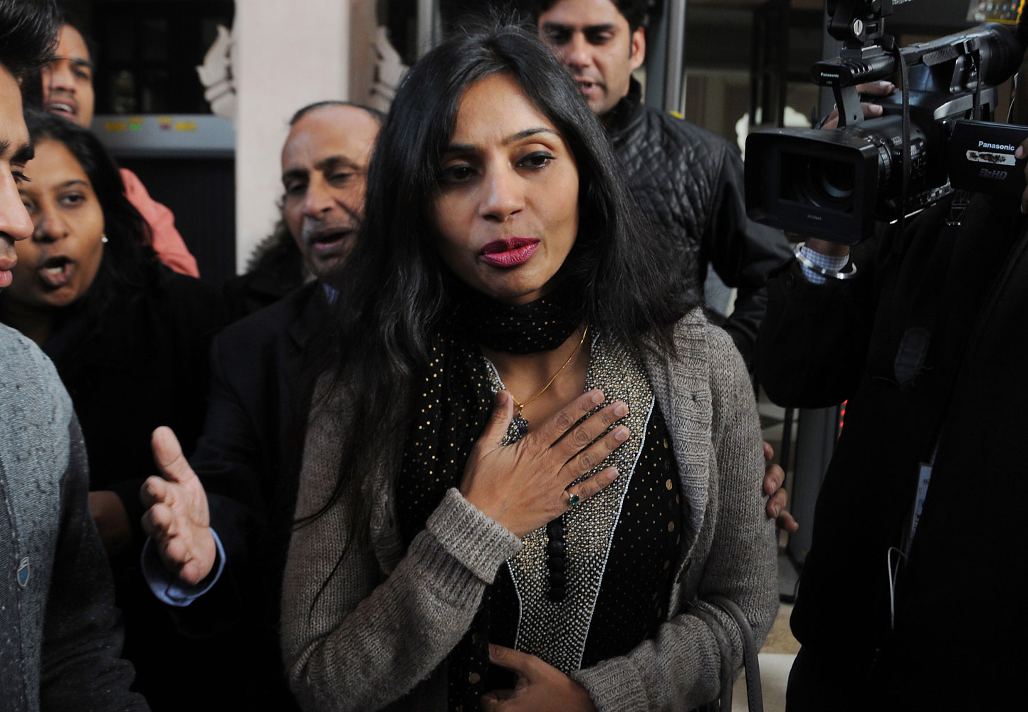 Indian diplomat Devyani Khobragade (C) leaves her guest house to meet with Indian Minister for External Affairs, Salman Khurshid in New Delhi on January 11, 2014. (AFP/Getty Images)