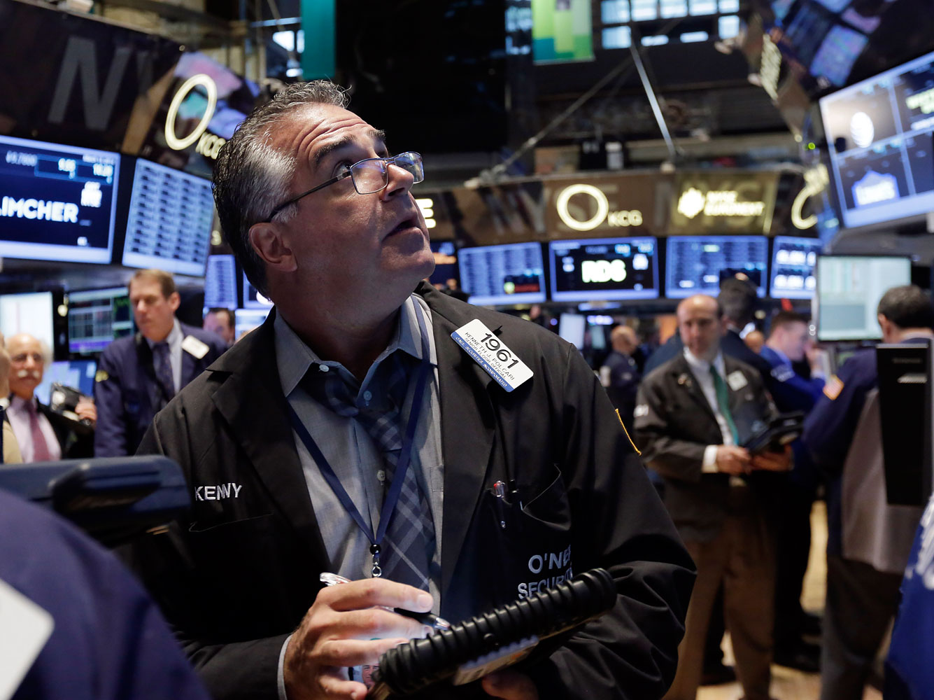 Trader Kenneth Polcari works on the floor of the New York Stock Exchange Thursday, March 13, 2014.