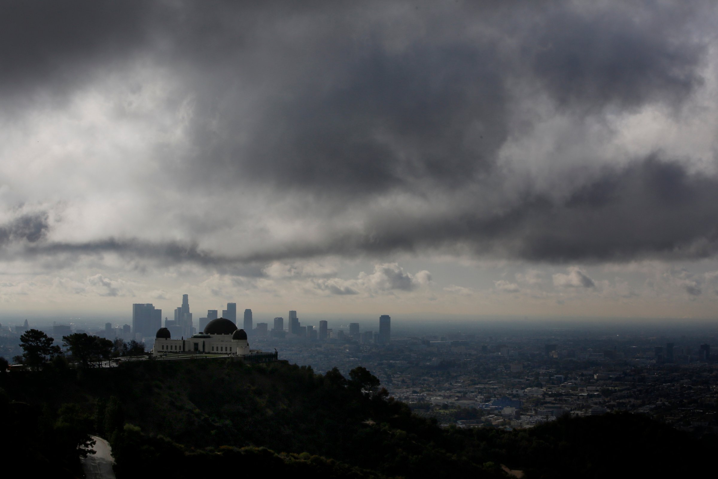The Griffith Observatory is seen as clouds gather above the skyline of Downtown Los Angeles in Los Angeles, California, U.S., on Thursday, Feb. 27, 2014.