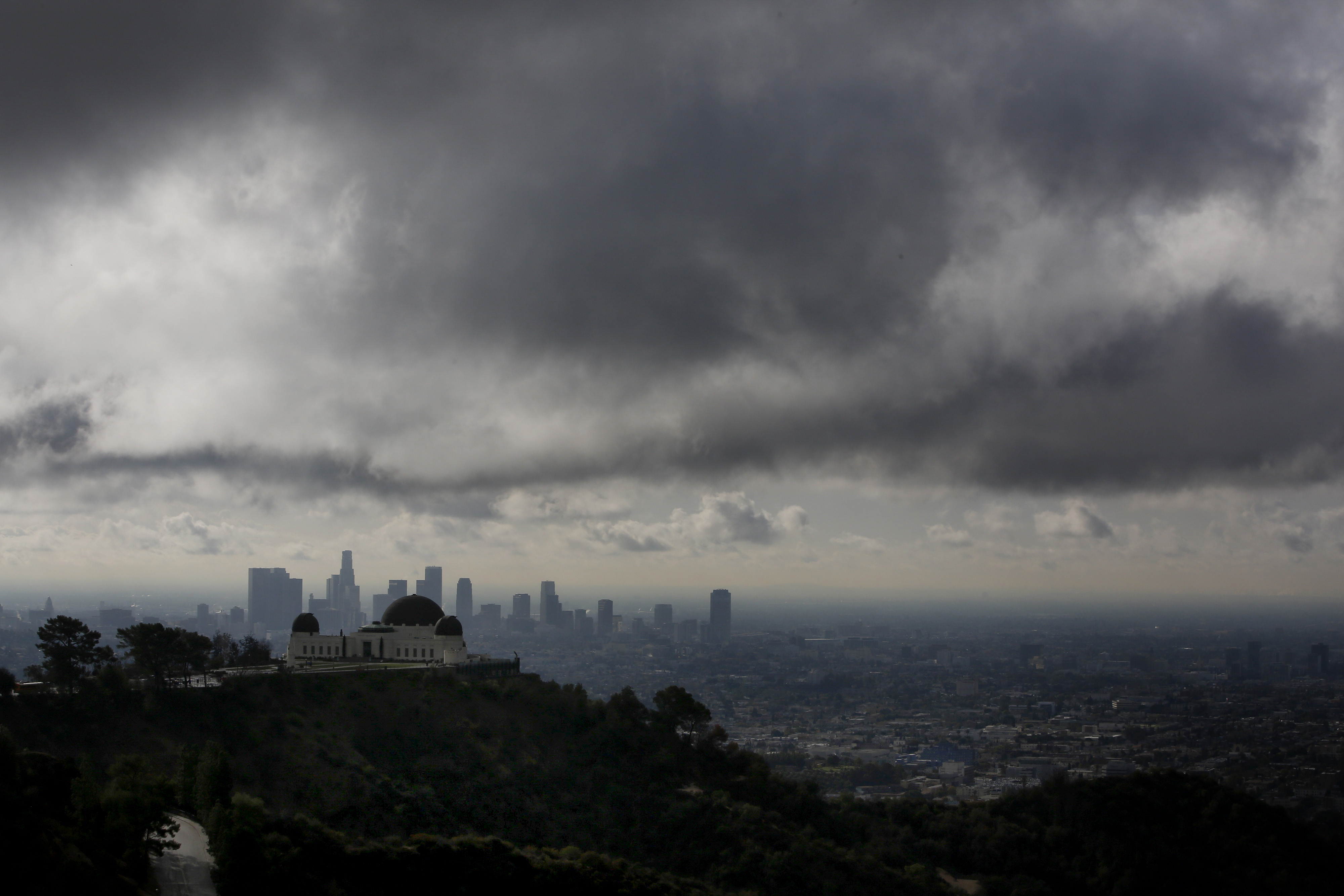 The Griffith Observatory is seen as clouds gather above the skyline of Downtown Los Angeles in Los Angeles, California, U.S., on Thursday, Feb. 27, 2014. 