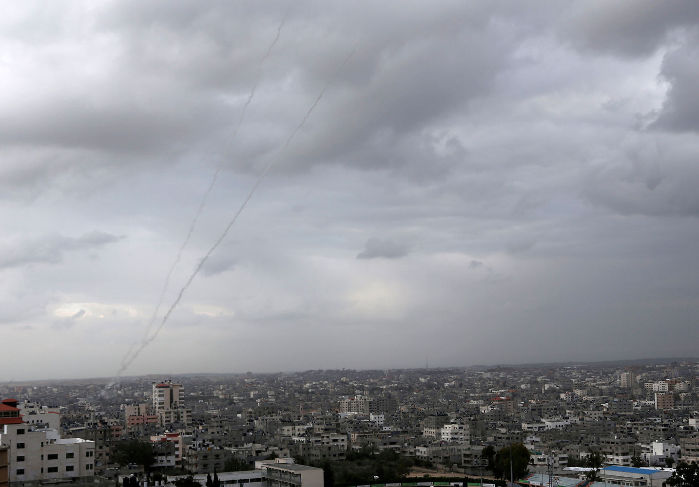 A trail of smoke from rockets fired by Palestinian militants from Gaza toward Israel is seen above Gaza City on March 12, 2014. (Adel Hana—AP)