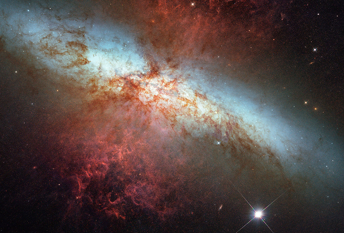 A Hubble Space Telescope composite image of a supernova explosion designated SN 2014J in the galaxy M82, at a distance of approximately 11.5 million light-years from Earth, released on Feb. 26, 2014.