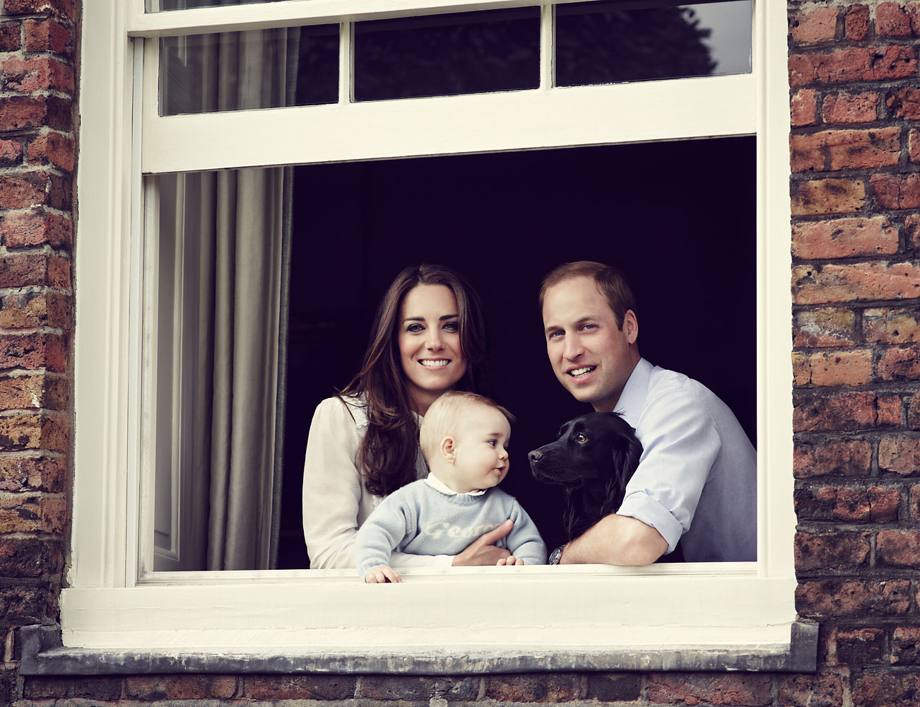 The Duke and Duchess of Cambridge with their son Prince George, photographed at Kensington Palace, March 2014. (Jason Bell—Camera Press/Redux)