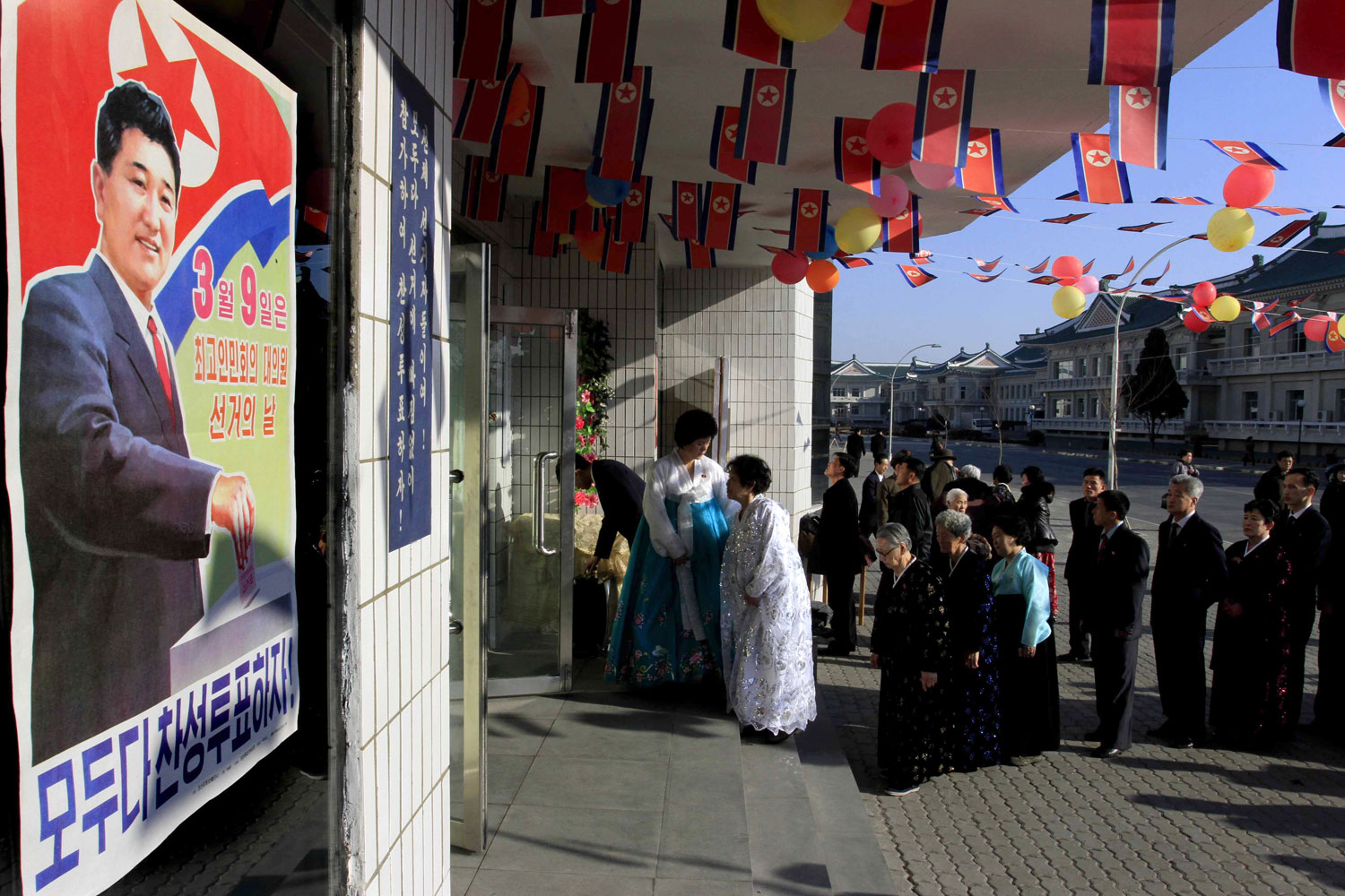 North Korean voters line up to cast their ballots to elect deputies for the Supreme People's Assembly in Pyongyang on March 9, 2014 (Jon Chol Jin—AP)