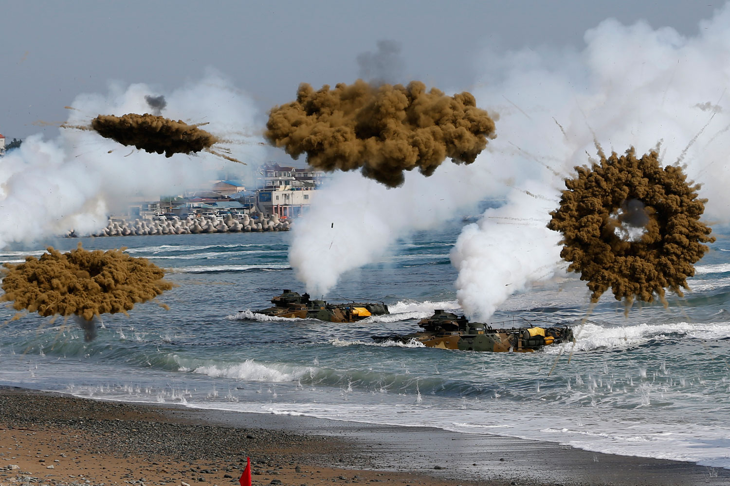 Amphibious assault vehicles of the South Korean Marine Corps throw smoke bombs as they move to land on shore during a U.S.-South Korea joint landing operation drill in Pohang March 31, 2014. (Kim Hong-Ji—Reuters)