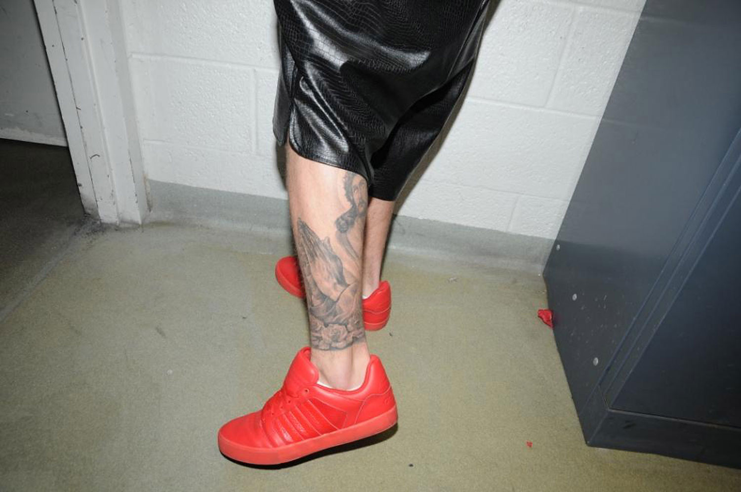 In this handout photo provided by the Miami Beach Police Department and released on March 4, 2014, singer Justin Bieber displays his tattoos for police documentation while in custody on January 23, 2014 in Miami Beach, Florida. (Miami Beach Police Department/Getty Images)