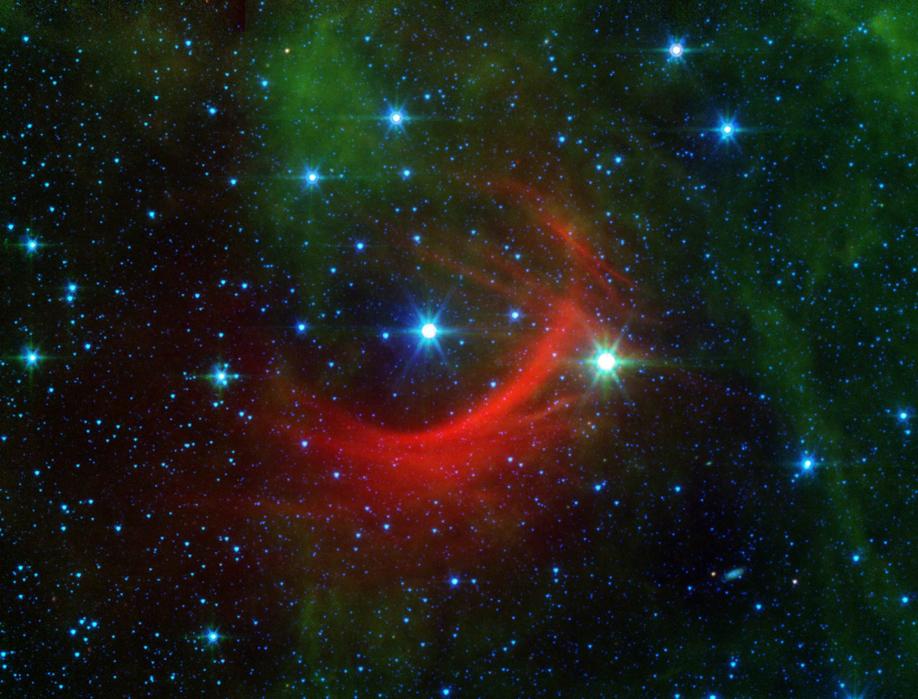 The Kappa Cassiopeiae star, or the HD 2905, taken from NASA's Spitzer Space Telescope (SST), released on Feb. 22, 2014. Kappa Cassiopeiae is a massive, hot supergiant moving at around 2.5 million mph relative to its neighbors (1,100 km per second). The surrounding red streaks of material in its path are called bow shocks, and they can often be seen in front of the fastest, most massive stars in the galaxy.
