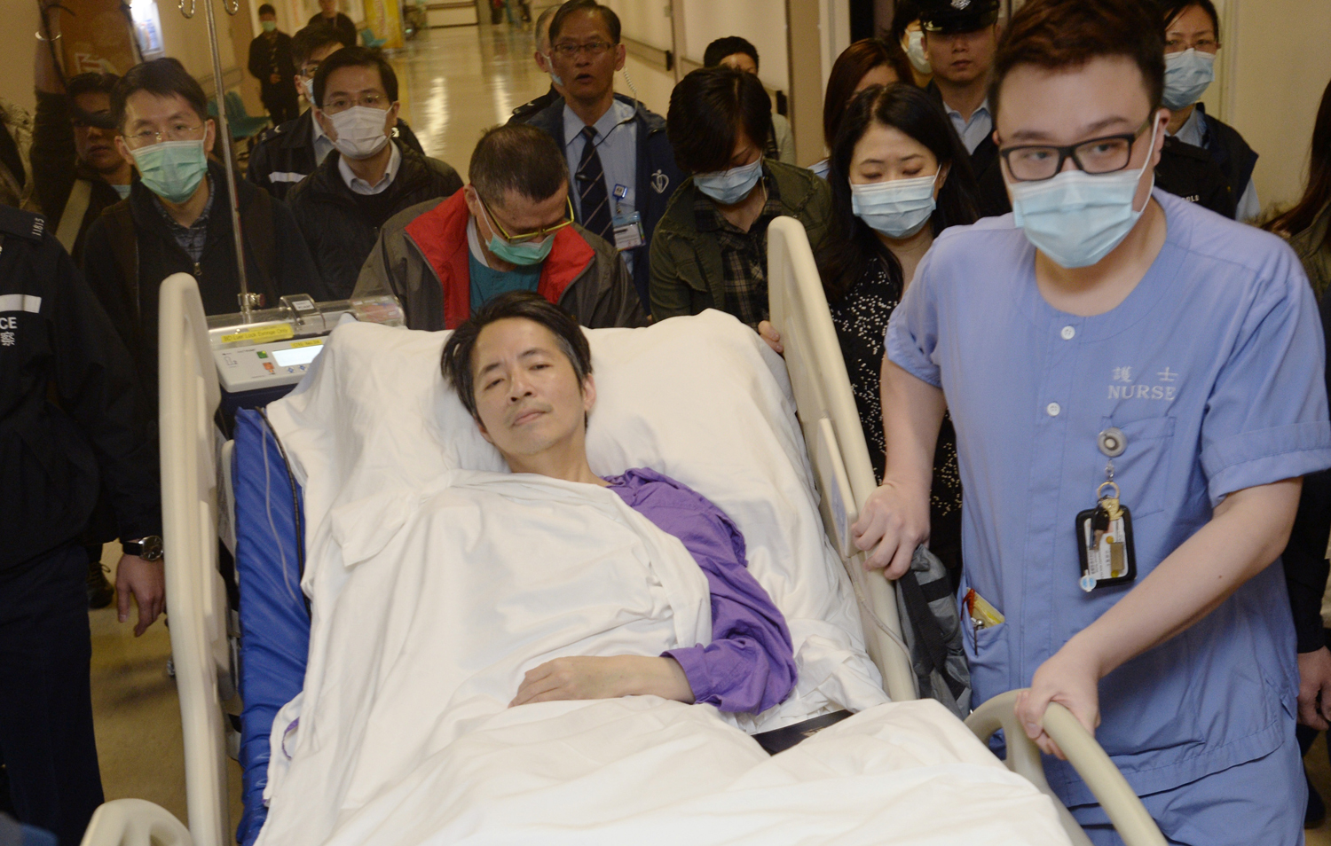 Ming Pao's former chief editor Kevin Lau, who was brutally attacked on Wednesday, is transferred to a private ward in Eastern Hospital after spending three days in intensive care in Hong Kong