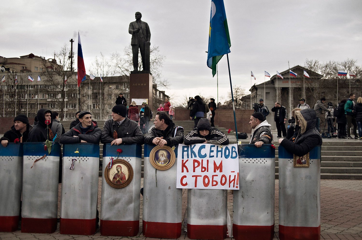 Members of a pro-Russian group stationed themselves in front of government buildings and a statue of Lenin in Simferopol on Sunday.