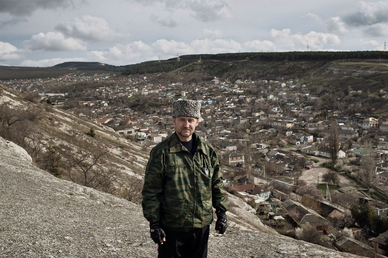 Sergei Yurchenko, the leader of a pro-Russian paramilitary force in Crimea, stands at a lookout point over his hometown Bakhchysarai, on March 16, 2014.