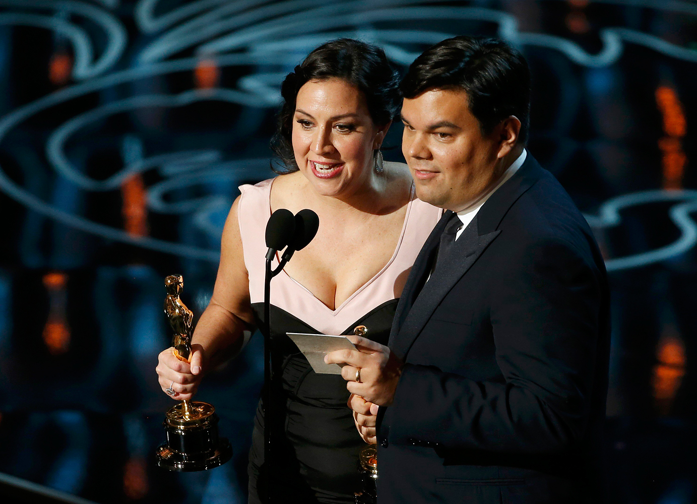 Kristen Anderson-Lopez and Lopez win for their song "Let It Go", best original song for the film "Frozen" at the 86th Academy Awards in Hollywood