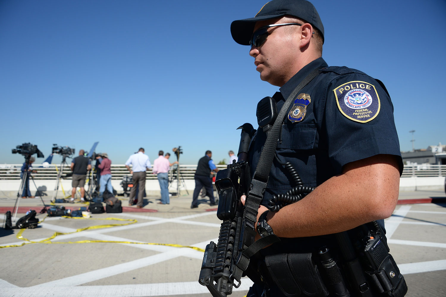 A policeman is positioned outside Terminal 3 at Los Angeles International Airport on November 1, 2013 after a gunman reportedly opened fire at a security checkpoint.  