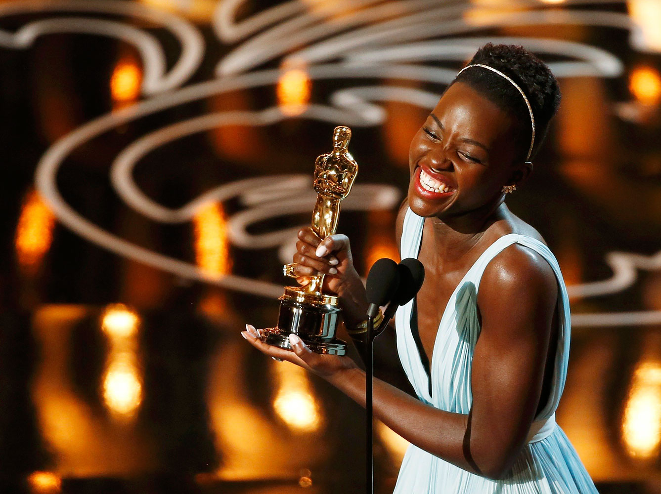 Lupita Nyong'o, best supporting actress winner for her role in "12 Years a Slave", speaks on stage at the 86th Academy Awards in Hollywood, California March 2, 2014. (Lucy Nicholson—Reuters)