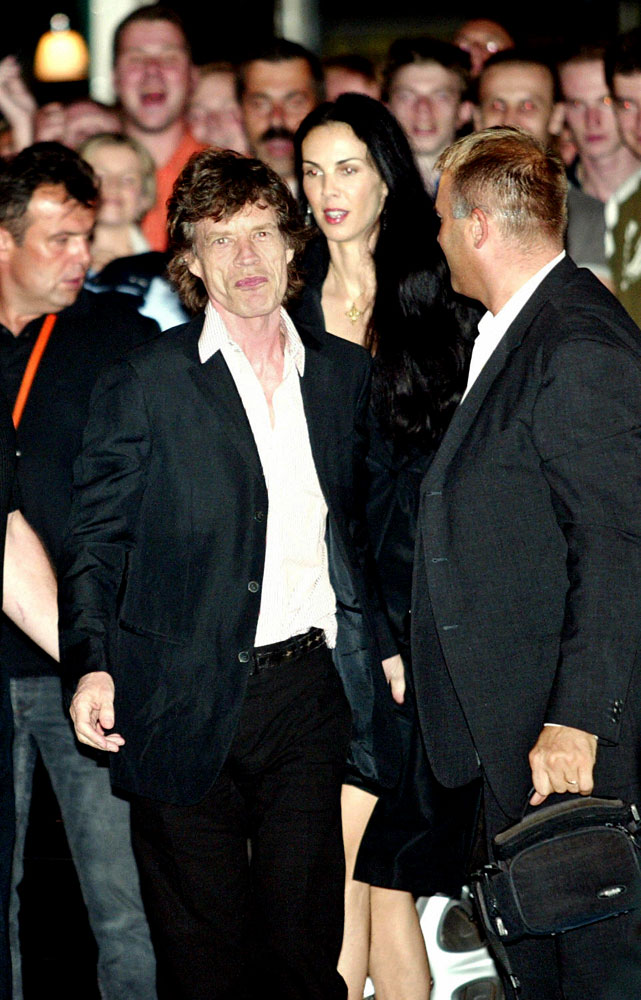 From left: Rolling Stones frontman Mick Jagger celebrates his sixtieth birthday with L'Wren Scott in Prague on July 26, 2003.