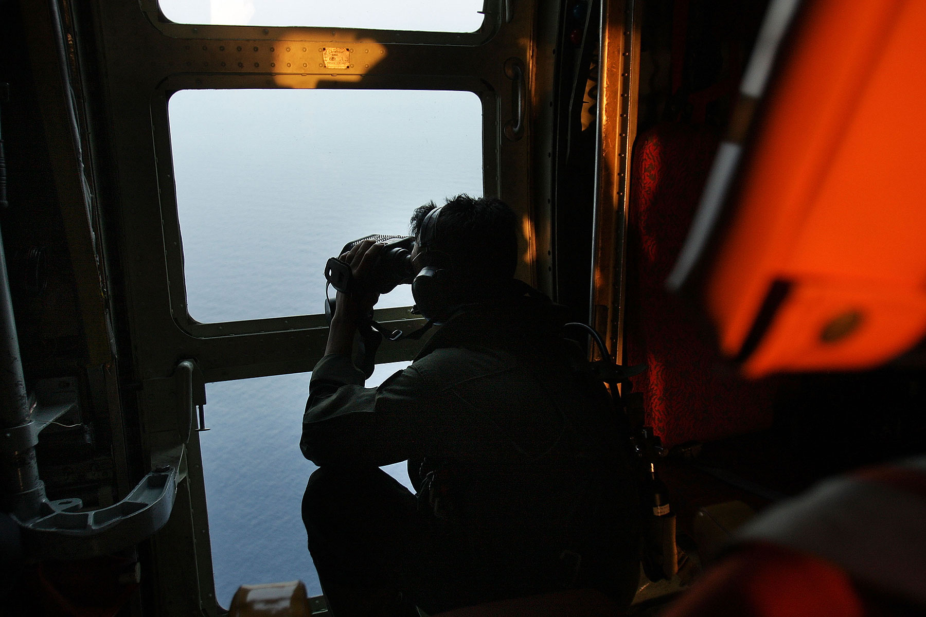 Malaysian Air Forces search the water for signs of debris from the Malaysian airliner during a search and rescue mission flight on March 13, 2014 in Kuala Lumpur, Malaysia (Rahman Roslan—Getty Images)