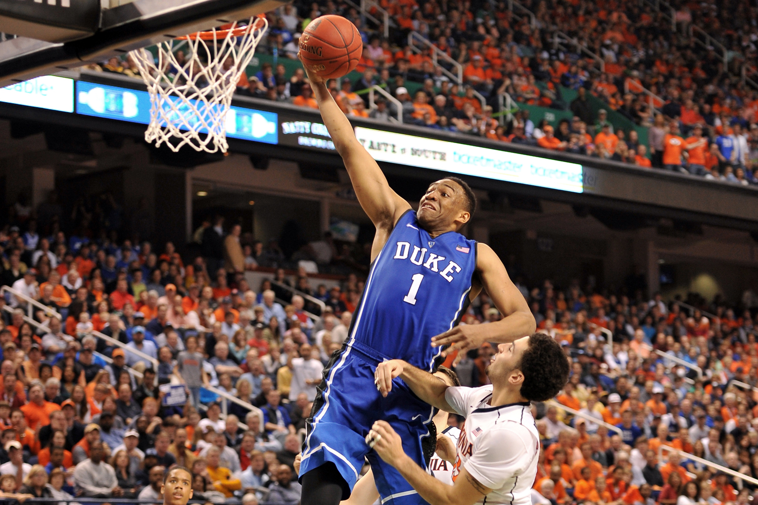 Jabari Parker, #1 of the Duke Blue Devils, goes up for a dunk against the Virginia Cavaliers during the finals of the 2014 Men's ACC Basketball Tournament on March 16, 2014 in Greensboro, North Carolina. Virginia defeated Duke 72-63. 
