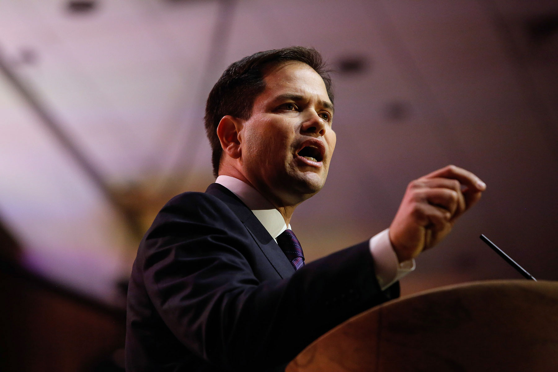The Texas state flag stands behind Senator Marco Rubio, a 