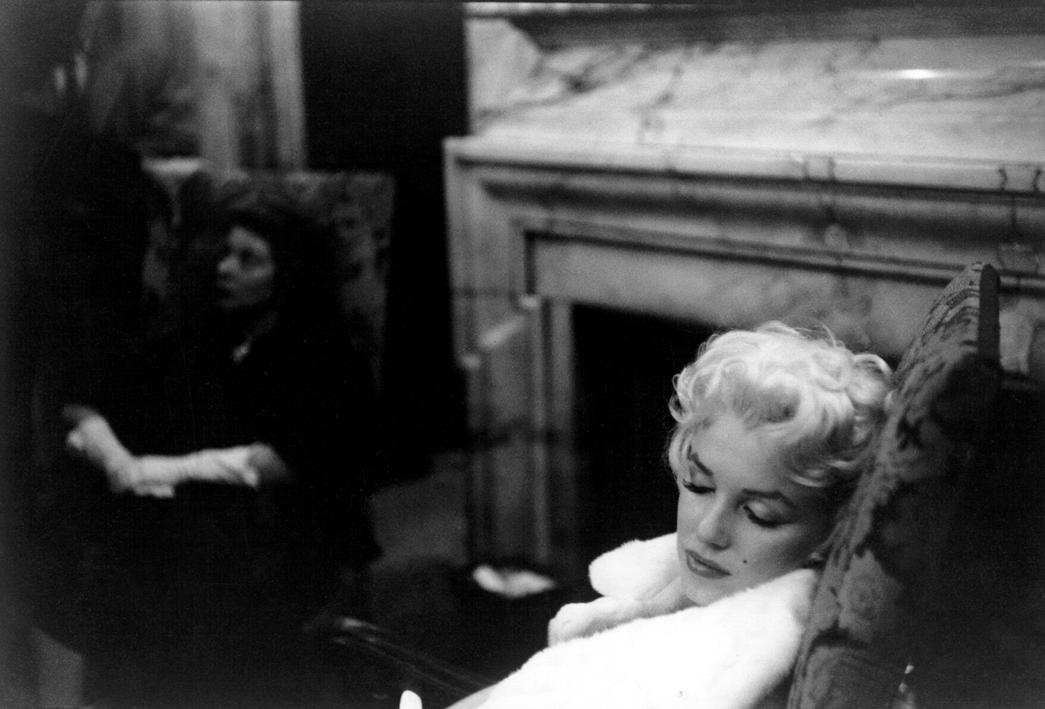 Actress Marilyn Monroe rests her eyes wearing a white fur coat on March 24, 1955 in New York City.