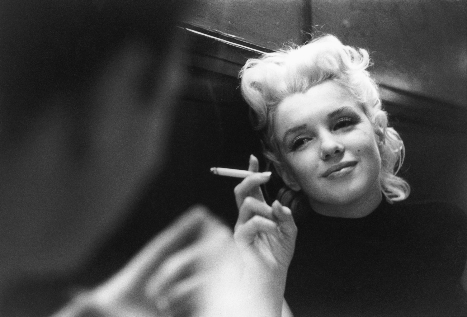Monroe has a smoke while relaxing in New York City.