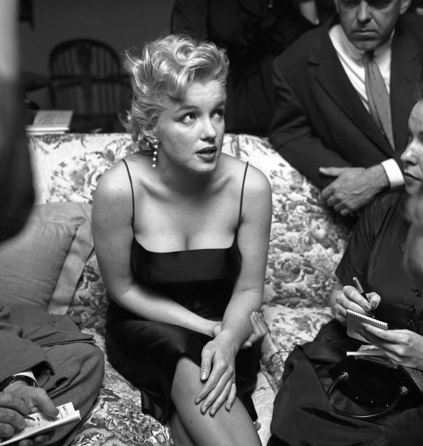 Reporters hound Monroe on March 3, 1956 in Hollywood, Calif.