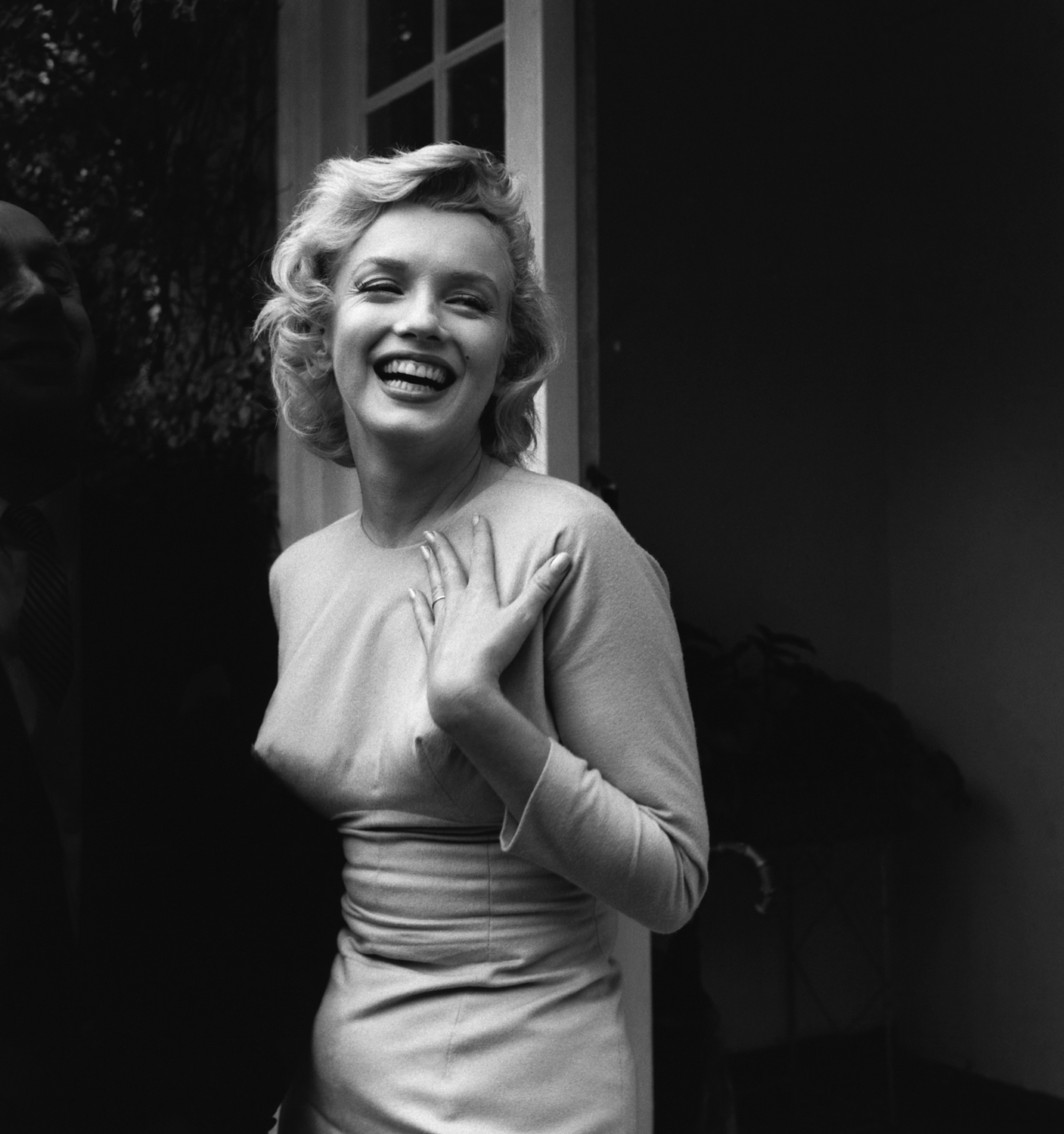Monroe cracking a wide smile in 1956.