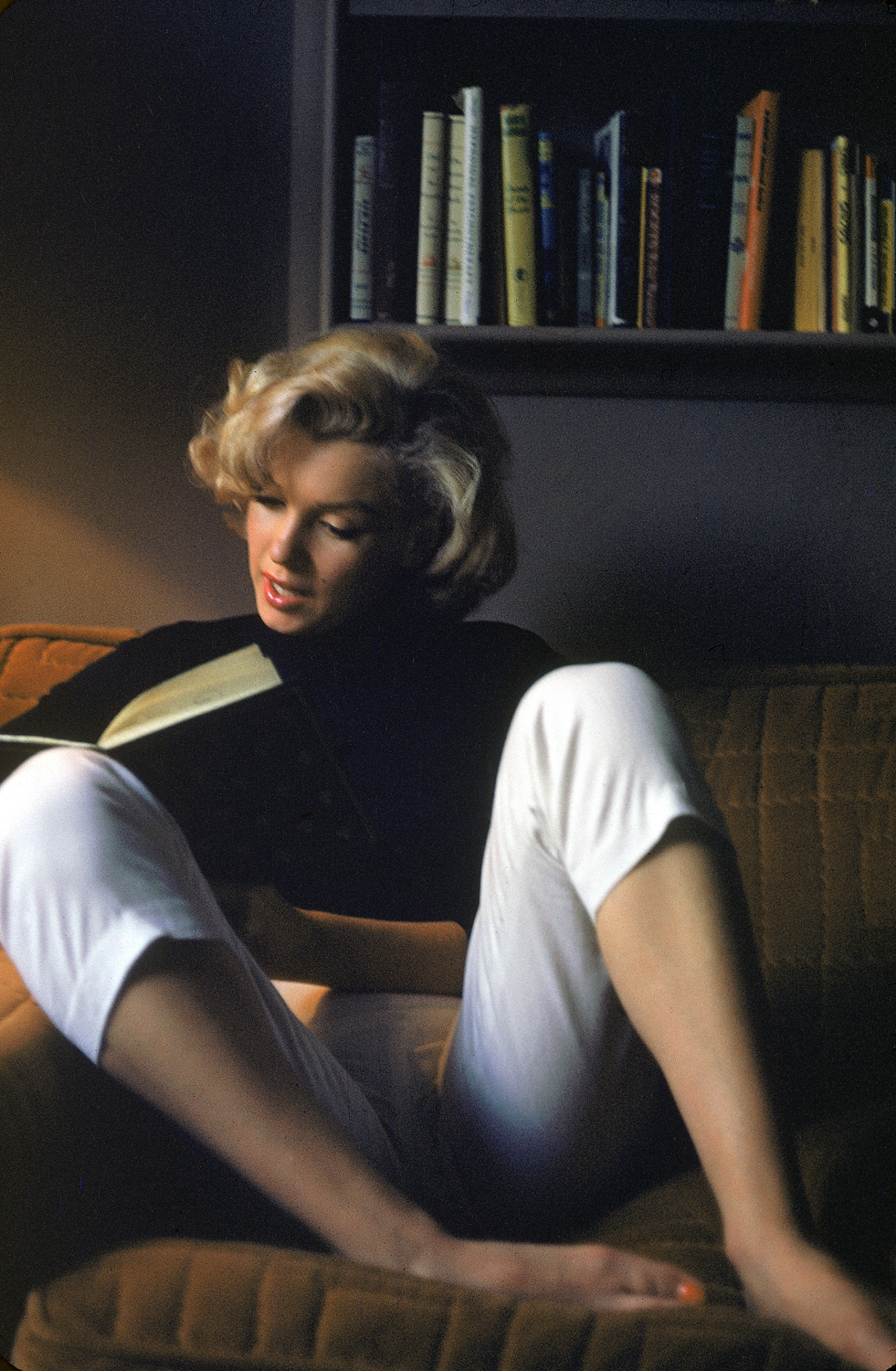 In this undated image, Monroe reads at home.